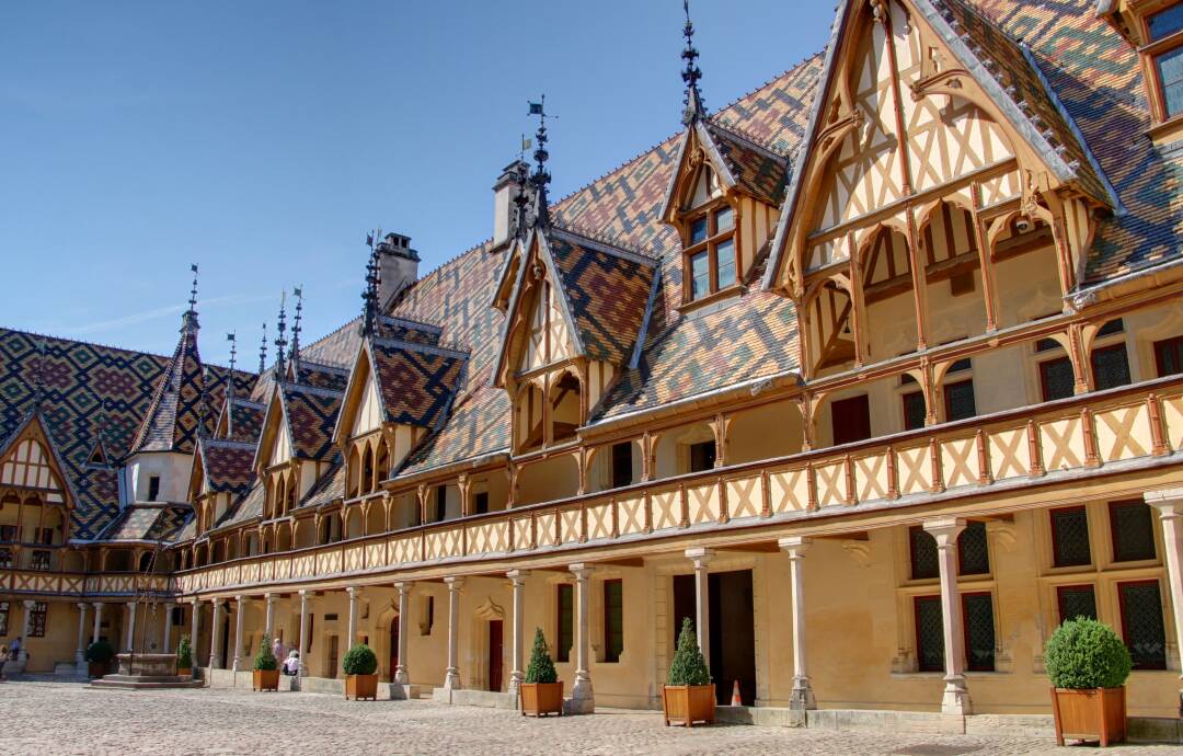 The Hospices de Beaune: The Hospices de Beaune is a listed building. Its flamboyant gothic style and its glazed tile roof make it one of the most famous in the world. Today, it houses a museum of medical history.