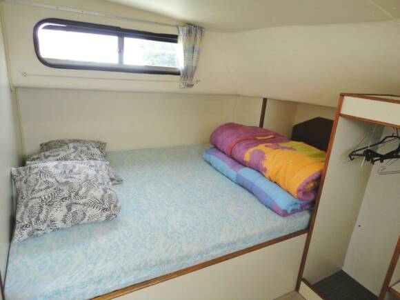 Triton 1050 - Front Cabin with a Double Bed and a Single Bed